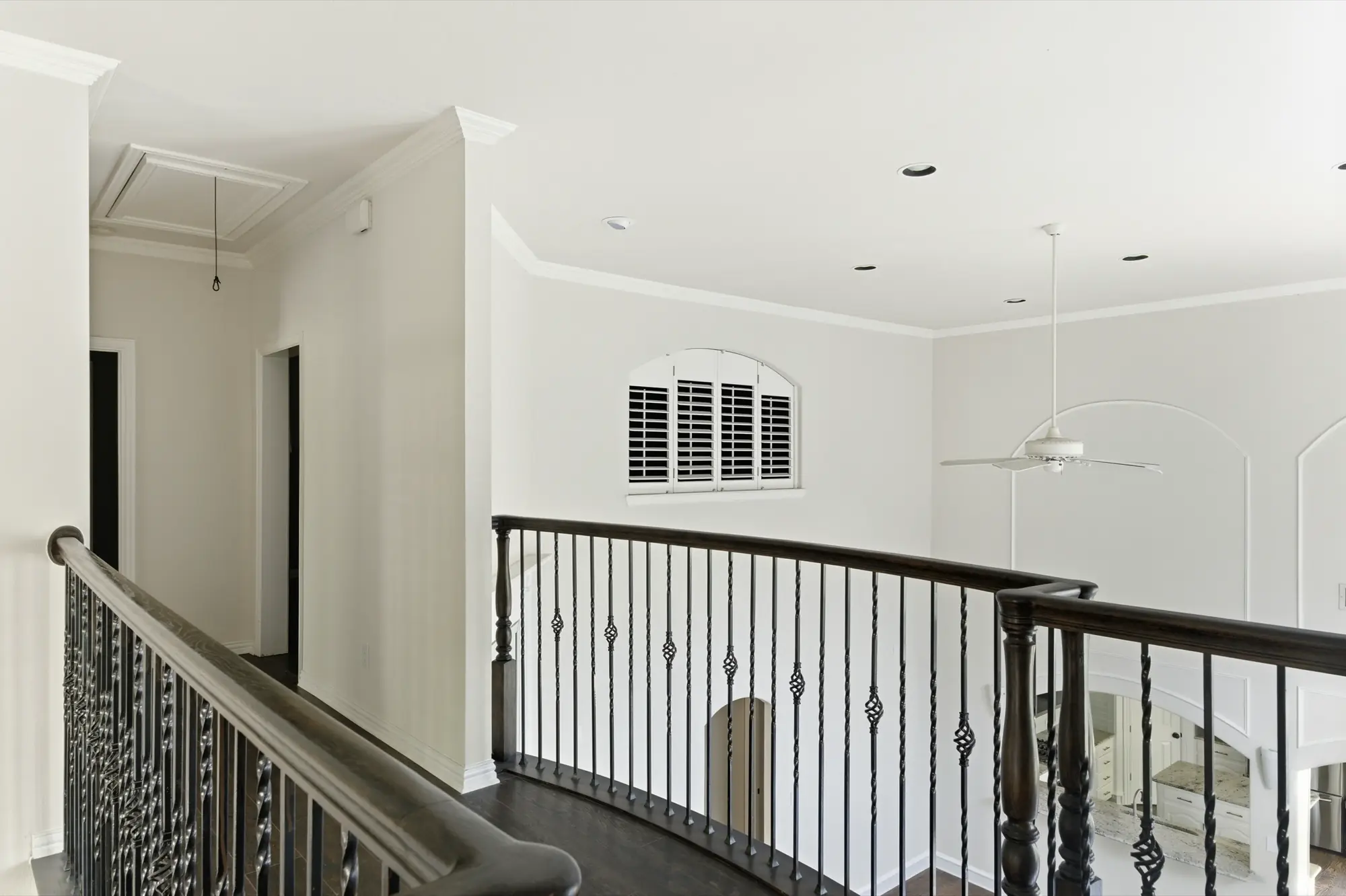Upstairs hallway with iron railing